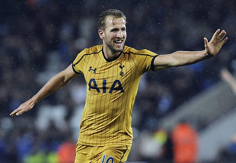 Tottenham's Harry Kane celebrates after scoring his third and his side's fifth goal of the game during the English Premier League soccer match against Leicester. | AP