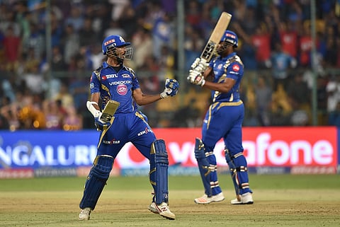 Mumbai Indians Krunal Pandya and Kieron Pollard celebrates win over Kolkata Knight Riders during the IPL 10 Qualifier2 match at Chinnaswamy Stadium in Bengaluru on Friday. | PTI