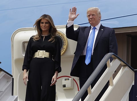 U.S. President Donald Trump, right, and first lady Melania Trump arrive at the Royal Terminal of King Khalid International Airport, Saturday, May 20, 2017, in Riyadh. (AP)