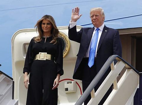 US President Donald Trump, right, and first lady Melania Trump arrive at the Royal Terminal of King Khalid International Airport on May 20. (Photo | AP)