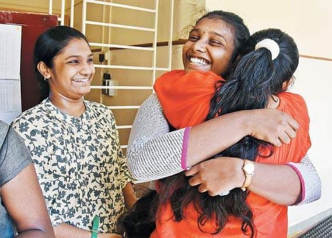 A student who scored good marks in her Class X board examination being greeted by another in a school at T Nagar in Chennai on Friday | ASHWIN PRASATH