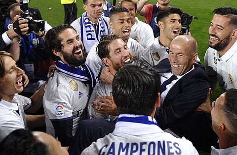 Real Madrid's head coach Zinedine Zidane celebrates with his players after winning a Spanish La Liga soccer match between Malaga. | AP