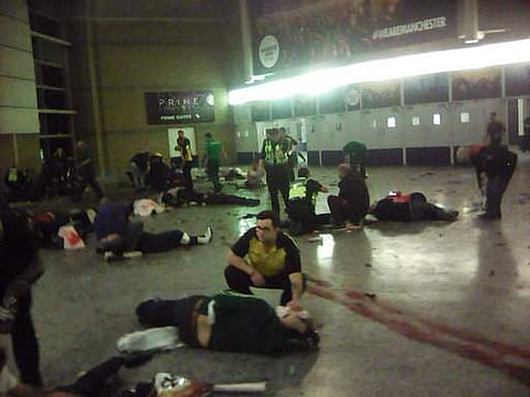 Helpers attend to injured people inside the Manchester Arena, Manchester, Britain, after a blast Monday, May 22, 2017. (Photo | AP)