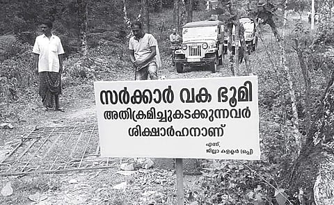 Revenue officers evicting an encroachment on government land at Lakshmi in Pallivasal village on Tuesday | Express