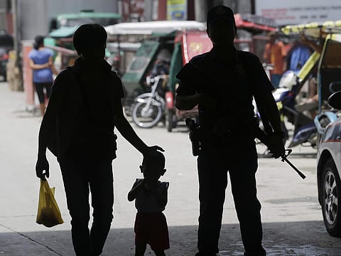 A policeman stands at a checkpoint in Manila, Philippines on May 24 following the declaration of martial law in Mindanao. (Photo | AP)