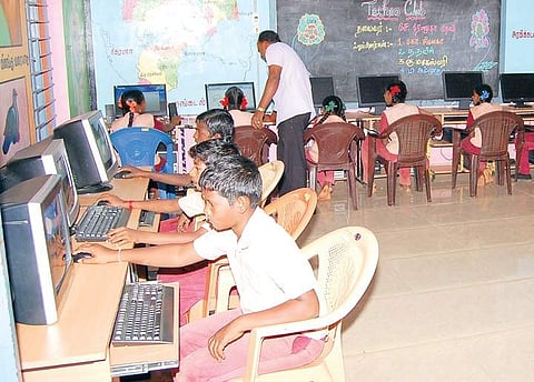 Students working on computers in the Panchayat Union Middle School at Kothavasal in Perambalur district; | Express
