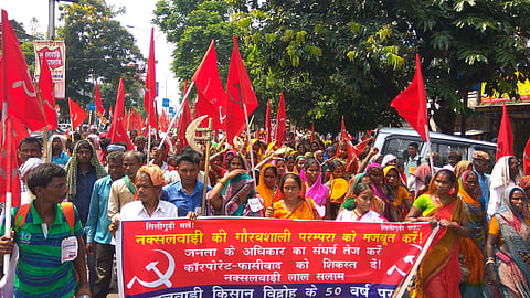 CPI (ML) Liberation activists from Bihar take part in rally to commemorate the 50th anniversary of Naxalbari revolution in Siliguri on Thursday. | (Aishik Chanda | EPS)