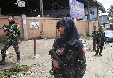 Government troops patrol the streets of Marawi city three days after Muslim militants lay siege in the city in southern Philippines. (Photo | AP)