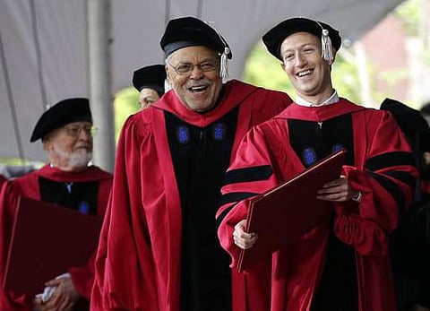 Actor James Earl Jones, center, laughs with Facebook CEO and Harvard dropout Mark Zuckerberg, right, during Harvard University commencement exercises | AP