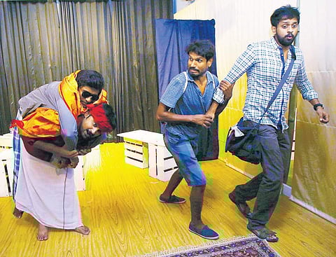 A scene from the play Rayil Petti