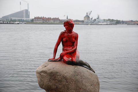 Red paint covers the vandalized tourist attraction The Little Mermaid in Copenhagen Tuesday May 30 2017. (AP)