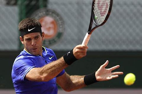 Argentina's Juan Martin Del Potro returns the ball to compatriot Guido Pella during their first round match of the French Open tennis tournament at the Roland Garros stadium. | AP