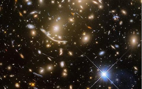 The galaxy cluster called Abell 370 contains an astounding assortment of several hundred galaxies tied together by the mutual pull of gravity. (Photo: NASA, ESA/Hubble)