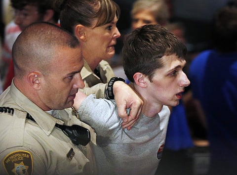 Police remove Michael Sandford as then Republican presidential candidate Donald Trump speaks at the Treasure Island hotel and casino in Las Vegas. (File|AP0