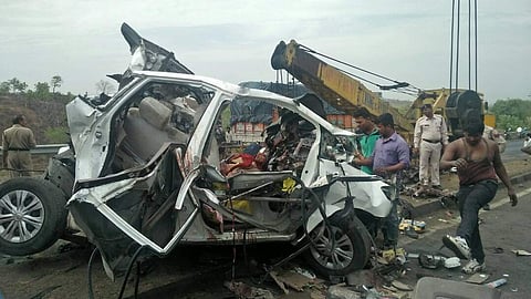 : Two cranes had to be used to extricate the bodies of the victims from the mangled vehicles. (EPS)