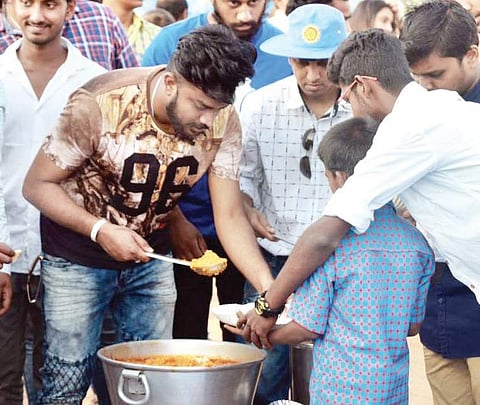 the group serving food to underprivileged