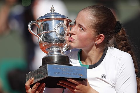 Latvia's Jelena Ostapenko kisses the trophy after winning the women's final match of the French Open tennis tournament against Romania's Simona Halep in three sets 4-6, 6-4, 6-3, at the Roland Garros stadium, in Paris. | AP