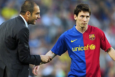 Former Barcelona coach Pep Guardiola (L) and striker Lionel Messi (File | AP)