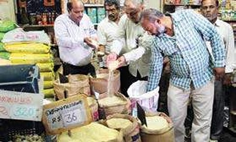 Officials of Tamil Nadu Food Safety and Drug Administration conducting raids at shops located in Kamarajar Salai in Madurai on Friday | K K SUNDAR