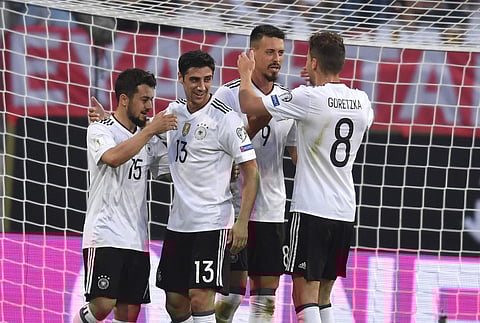 Germany's Sandro Wagner, second right, celebrates his goal at 3:0 with Amin Younes, left, Lars Stindl, second left, and Leon Goretzka, right, during the World Cup qualifier Group C soccer match against San Marino at the Stadion Nuernberg in Nuremberg. | A