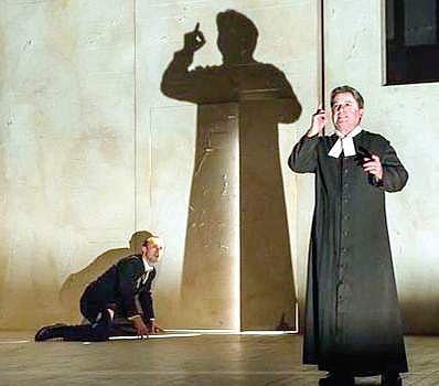 Johnny Herford (Josef K), Nicholas Folwell (Priest) enacting The Trial as an opera