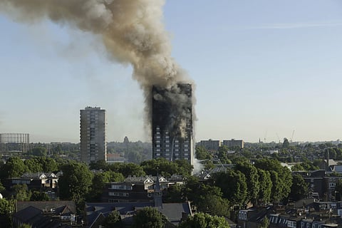 Smoke rises from Grenfell Tower on fire in London on Wednesday. (AP)