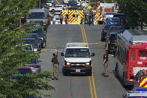 Police and emergency personnel are seen near the scene where House Majority Whip Steve Scalise of La. was shot during a Congressional baseball practice in Alexandria on June 14. (Photo | AP)