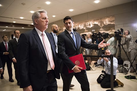 House Speaker Paul Ryan of Wis., right, and House Majority Leader Kevin McCarthy of Calif. walk to a security briefing for lawmakers on Capitol Hill in Washington, Wednesday, June 14, 2017, after a gunman opened fire wounding House Majority Whip Rep. Stev