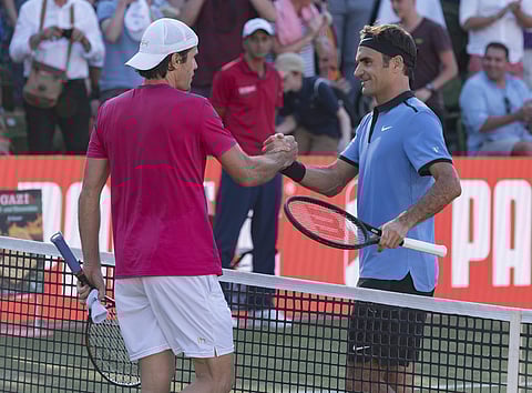 Roger Federer of Switzerland, right, congratulates Germany's Tommy Haas on his victory during their match at the Mercedes Cup tennis tournament in Stuttgart, Germany. | AP
