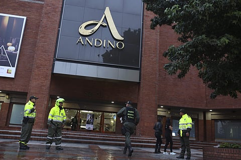 A member of the police bomb squad rushes to the Centro Andino shopping mall in Bogota, Colombia, Saturday, June 17, 2017. | AP