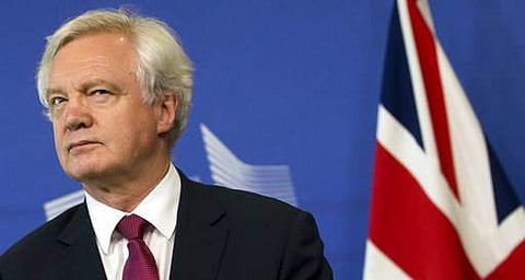 British Secretary of State David Davis listens to opening remarks during his arrival at EU headquarters in Brussels on Monday. | AP