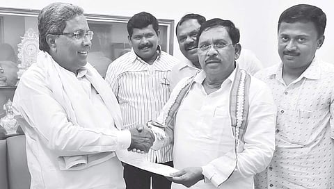 G Parameshwara handing over his resignation as Home Minister to Chief Minister Siddaramaiah in Bengaluru on Thursday