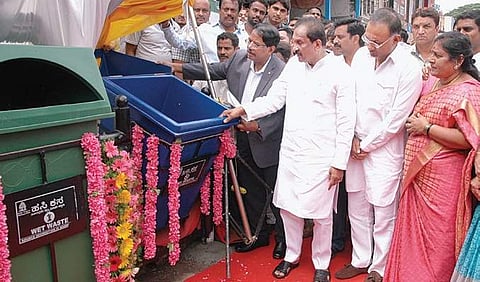 BBMP commissioner Manjunath Prasad, minister K J George, KPCC working president Dinesh Gundu Rao and Mayor Padmavathi inagurate the bin system at National Market on Monday | express