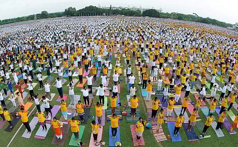 More then 45,000 people take part in a yoga camp in Mysuru on Wednesday. (EPS | Udayashankar S)
