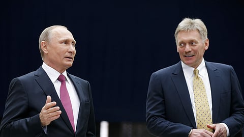 Russian President Vladimir Putin with Dmitry Peskov.