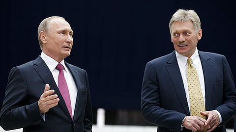 Russian President Vladimir Putin with Dmitry Peskov.