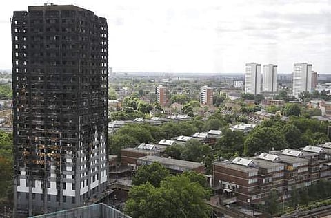 The burnt Grenfell Tower apartment building stands testament to the recent fire in London. | AP