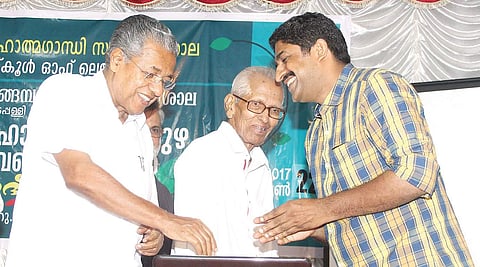 Chief Minister Pinarayi Vijayan, M K Sanu and Harikumar Changampuzha at the inauguration of the web portal of poet Changampuzha Krishna Pilla at MGU Regional Centre at Edappally on Thursday | Melton Antony