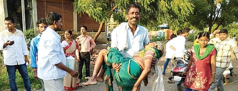 Ninganna carrying Siddamma to a hospital in Kalaburagi | Express