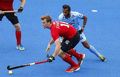 Canada's Gordan Johnston and India's Sunil Sowmarpet, right, in action during the Men's World Hockey League semifinal at Lee Valley Hockey Centre, London. | AP