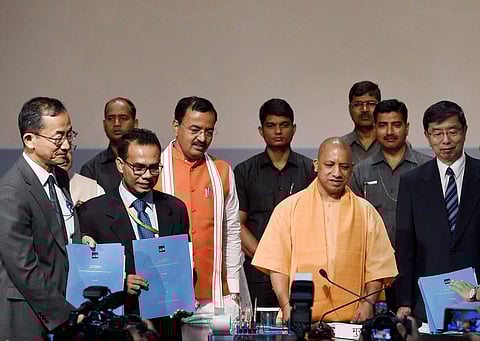 UP CM Yogi Aditiyanath with Takehiko Nakao President Asian Development Bank after signing up of agreement between his government and ADB at Lok Bhawan in Lucknow on Tuesday. (PTI)