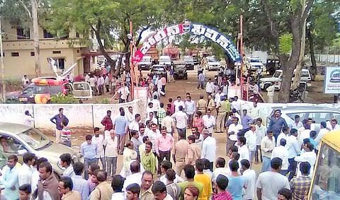 People gather in front of Kukunoorpally police station after SI Prabhakar Reddy’s suicide