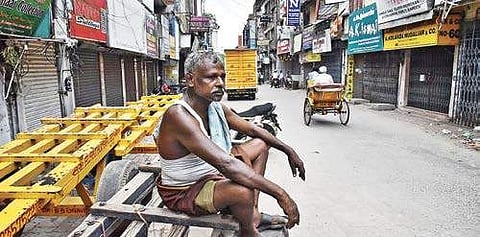 A jobless worker at Godown Street in Sowcarpet in the city on Wednesday, after textile shops downed their shutters against the proposed implementation of Goods and Services Tax from July 1 | P Jawahar