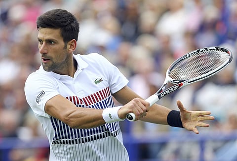 Serbia's Novak Djokovic in action during his match against Donald Young of the United States at the AEGON International tennis tournament at Devonshire Park, Eastbourne. | AP