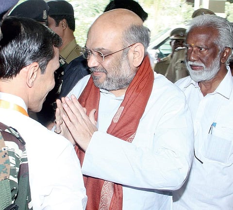 BJP leader M T Ramesh receiving BJP national president Amit Shah in Kochi on Friday. BJP state president Kummanam Rajasekharan looks on | Melton Antony