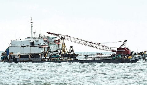 A barge with 27 workers on board seen sinking off Ullal on Saturday. File photo by EPS)