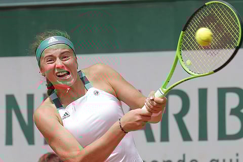 Latvia's Jelena Ostapenko plays a shot against Australia's Samantha Stosur during their fourth round match of the French Open tennis tournament at the Roland Garros stadium, in Paris. | AP