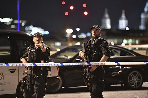 Armed Police officers stand guard on London Bridge in central London after the attack on Saturday. (File | AP)