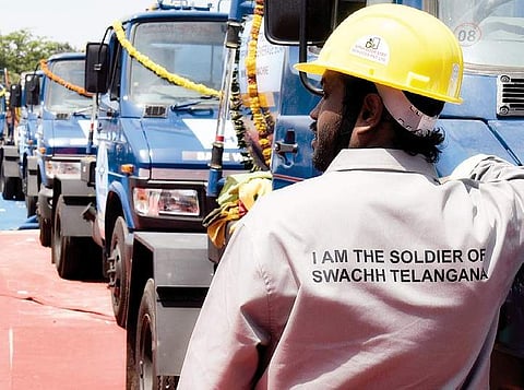 Water board worker looks on with the launch of 70 mini sewer jetting machines at People’s Plaza in Hyderabad on Monday | vinay madapu