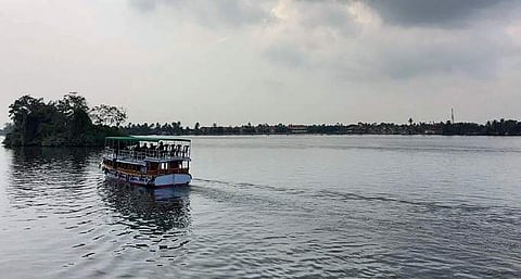 A boat taking tourists on a cruise through the backwaters |Photo by PVN